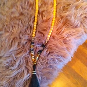 Horsetail tassel necklace, black and brass beads